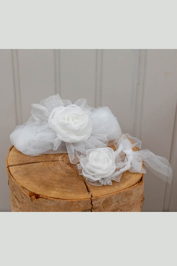 Set of white headwrap and hand boutonniere